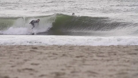 Surfer surfing on waves in slow motion Stock Footage 71566410