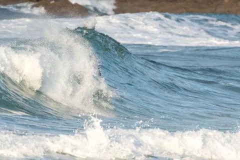 Surfer swallowed by a big wave on a beach on the north coast of Spain Foto stock