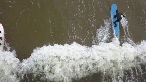 Surfer swims on a wave, view from above, Teriberka Stock Footage 152858686