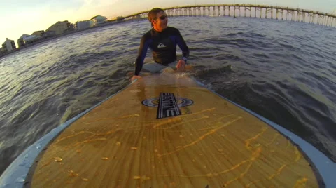 Surfer takes on the waves in the Ocean Stock Footage 42559000
