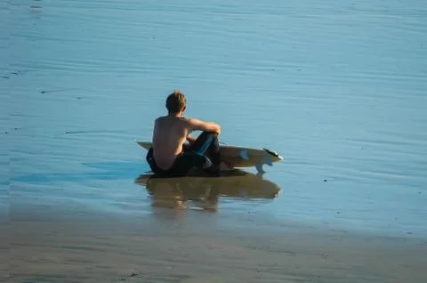 Surfer taking a break Stock Photos