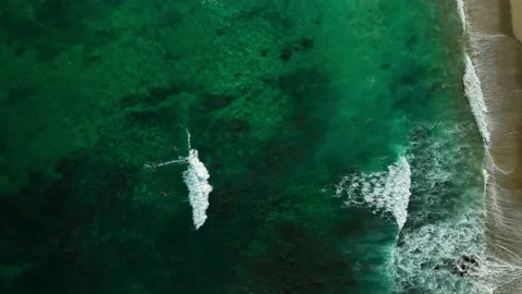 Surfer Taking a long wave overhead turquoise water Stock Footage 236742026