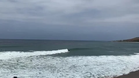 Surfer Taking on wave at the beach Stock Footage 236259676
