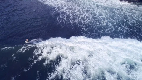 Surfer at the top of the wave in the ocean, top view Stock Footage 102992836