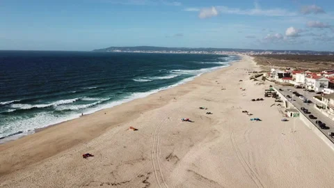 Surfer Town on Beach 4k Drone Stock Footage 147440168