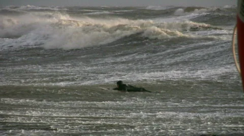 Surfer trying to catch the wave Stock Footage 548521