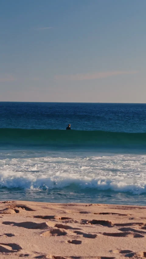 Surfer waiting for perfect wave in Atlantic Ocean lineup. Video stock 337317036