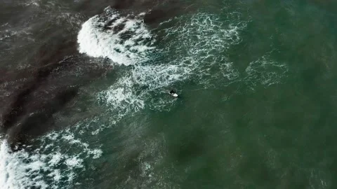 Surfer waiting for some waves, 4k Stock Footage 131859972