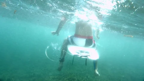 Surfer waiting for a wave Stock Footage 72569175