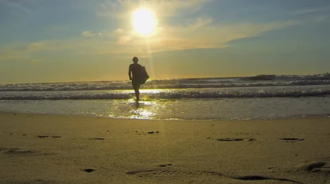 Surfer Walking Across Beach Stock Footage 36135148