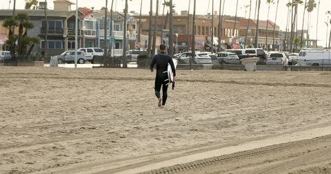 Surfer Walking at the Beach Stock Footage 102150538