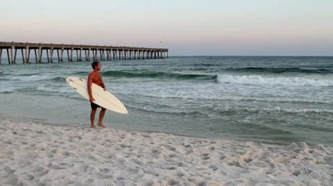 Surfer Walking Beach Pan Video stock 10845114