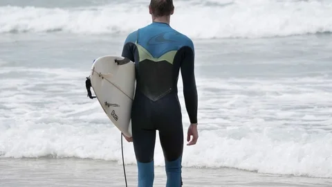 Surfer Walking Beach Slowmotion 4k Stock Footage 77255345