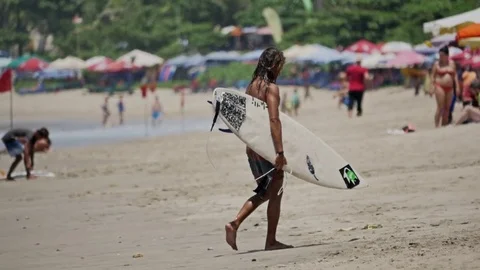 Surfer Walking Beach Surfboard Bali Kuta Slowmotion Stock-Footage 70761427