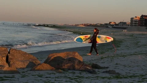 Surfer Walking to the Ocean Stock Footage 97723958