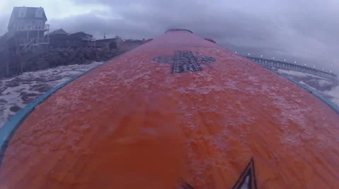 Surfer walks down the beach Stock Footage 42571163