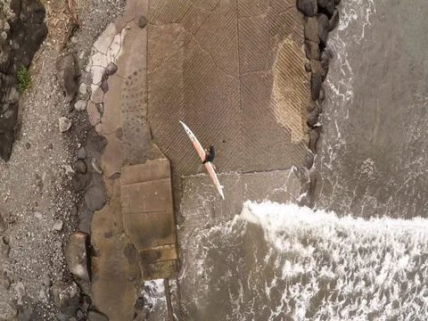 Surfer Walks Out Of Ocean Stock Footage 83046212