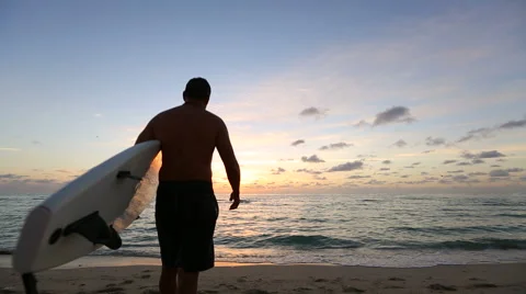 Surfer Walks toward Ocean Stock Footage 41793170