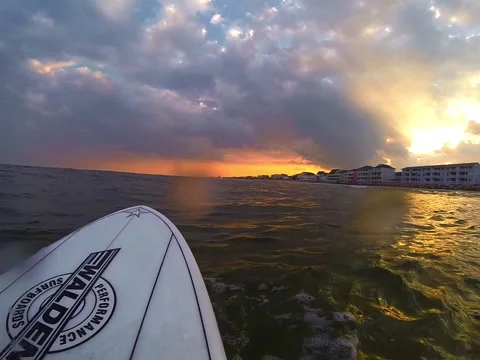 Surfer watches the sunset Video stock 42544554