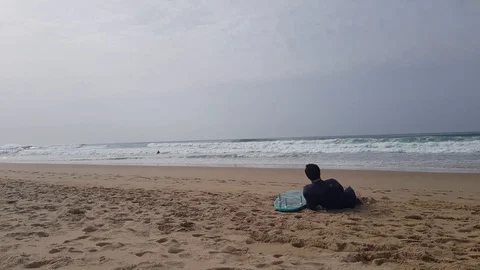 Surfer watching the waves Stock Footage 103204991