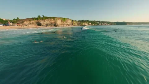 Surfer on the wave in Bali — FPV drone aerial view Stock-Footage 249791645