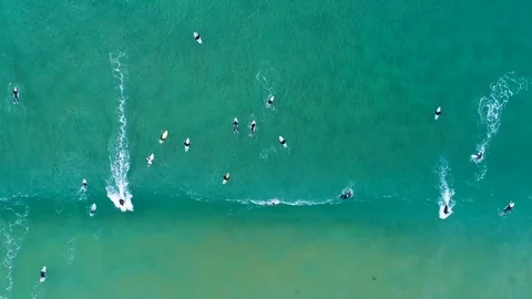 Surfer on a wave from far above Stock Footage 122281161