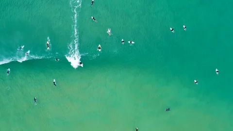 Surfer on a wave from far above Stock Footage 122281425