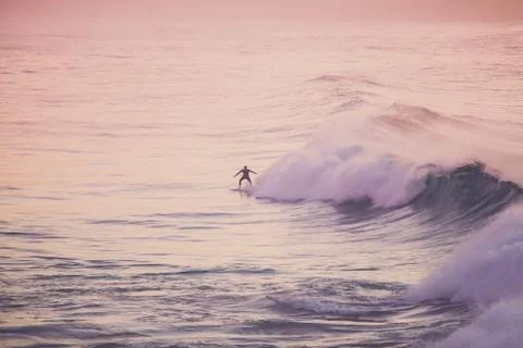 A surfer on a wave Stock Photos
