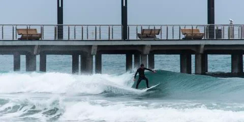 Surfer on a wave Stock Photos
