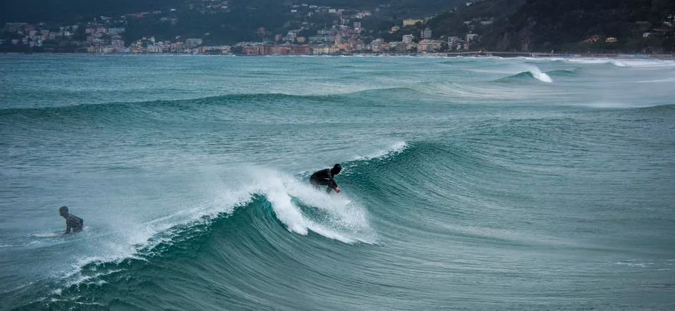 Surfer on a wave Stock Photos