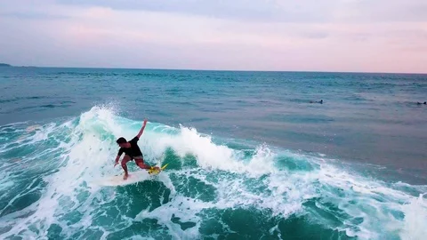 .Surfer on the wave at sunset, view from the drone, Sri Lanka, hikkaduwa, dyn Stock Footage 109130431