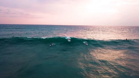 Surfer on the wave at sunset, view from the drone, Sri Lanka, hikkaduwa, dyn Stock Footage 109130495