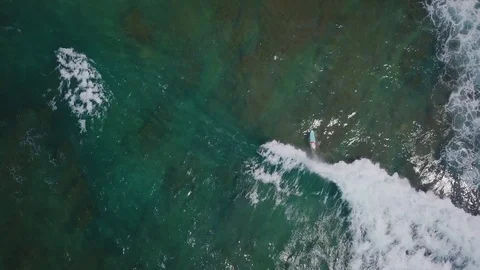 Surfer on the wave at sunset, view from the drone, Sri Lanka, hikkaduwa, dyn Stock Footage 109133028
