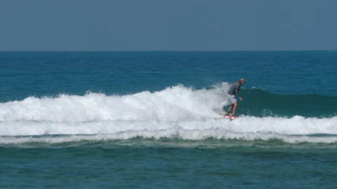 Surfer on the waves Stock Footage 139928048