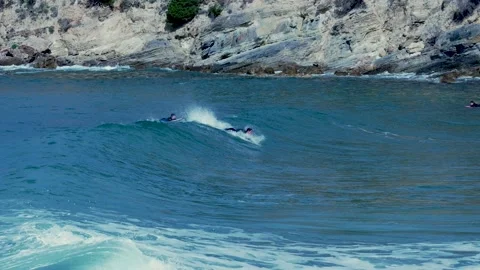 Surfer on a waves at morning Stock Footage 133514962
