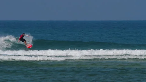 Surfer on the waves at sea Stock Footage 157117425