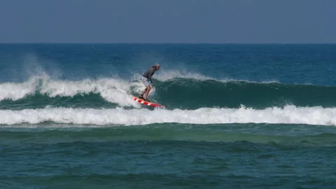 Surfer on the waves at sea Video stock 157233136