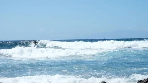 Surfer on waves slow motion Stock Footage 185525781