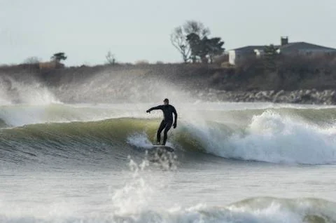 Surfer waves spray bluff Stock Photos