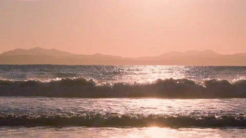 Surfer with waves, sunset ocean, Vancouver Island, West Coast, waves crashing at Stock Footage 168965793