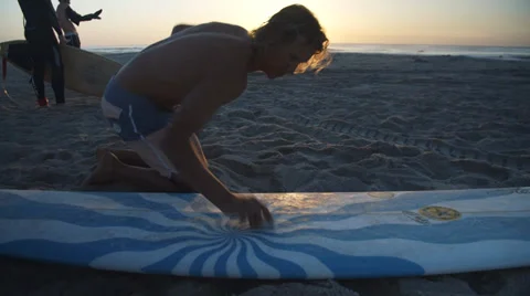 Surfer Waxing Board On Beach Stock Footage 39210690