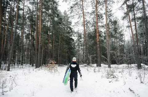 Surfer in the winter forest Stock Photos