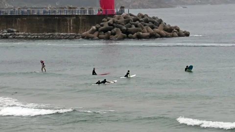 Surfers at the 38th parallel Stock-Footage 91645239