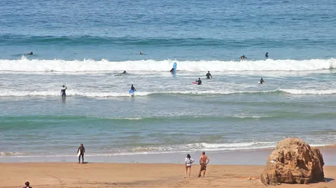 Surfers in action, riding the waves Stock Footage 23057352