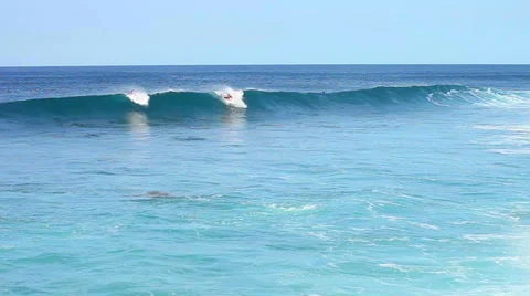 Surfers in action, riding the waves Stock Footage 34034094