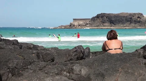 Surfers in action, riding the waves Stock Footage 36496417