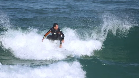 Surfers In Action, Riding The Waves Stock Footage 71071429