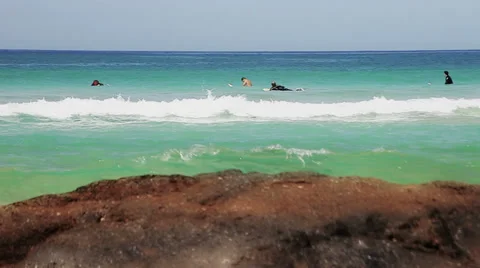 Surfers in action, waiting for the perfect wave Stock Footage 34022320