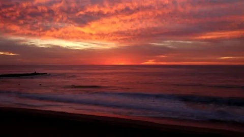 Surfers after sunset Stock Footage 82872443