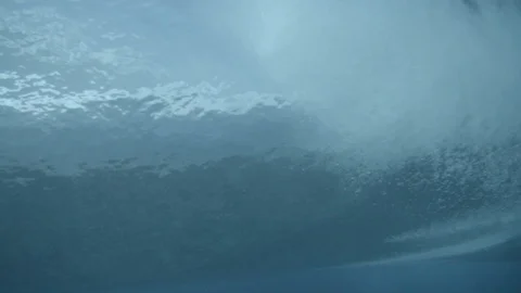 Surfers and rolling waves under the sea Stock Footage 108643988